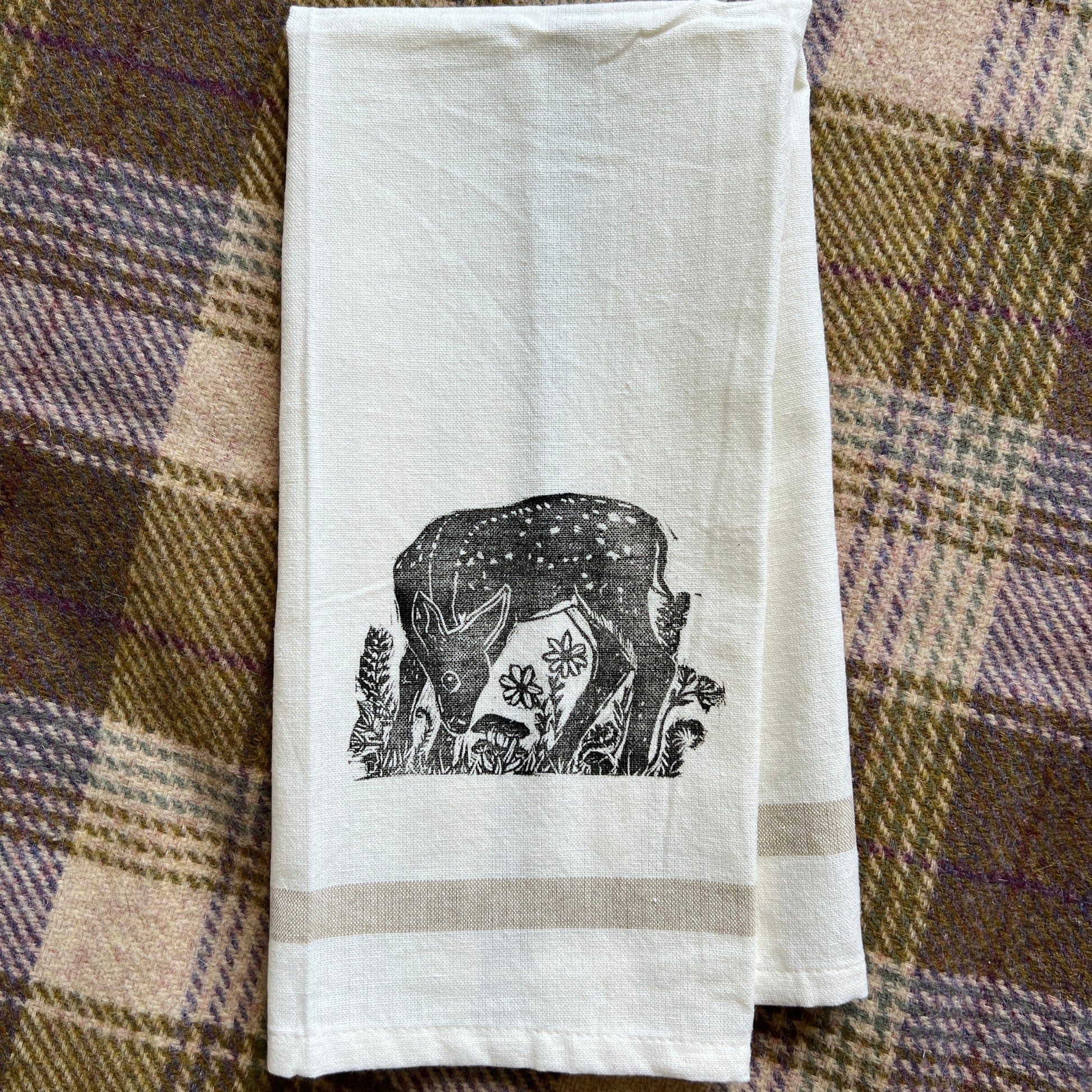 White tea towel with black stamped fawn design