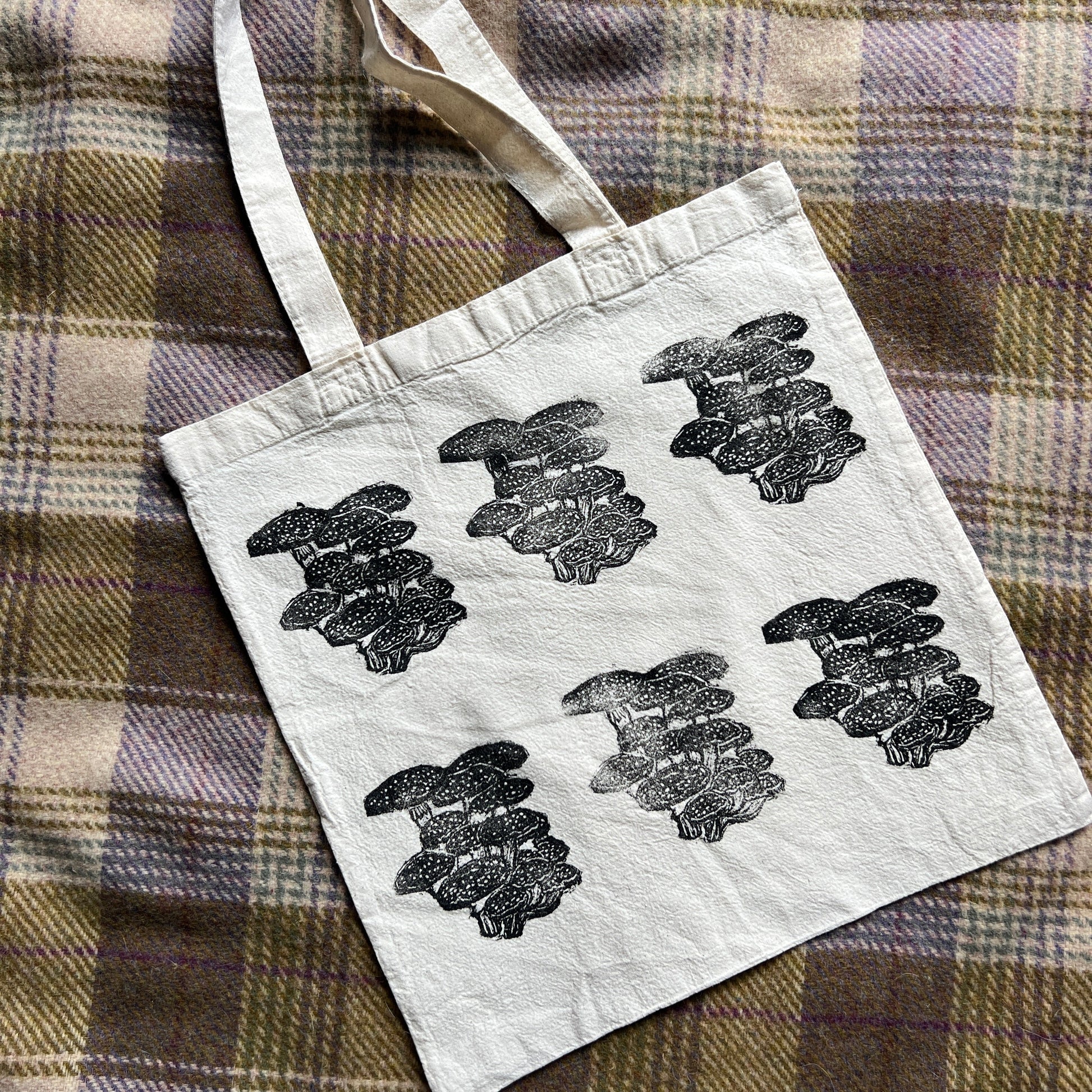 canvas tote bag with black stamped mushroom design