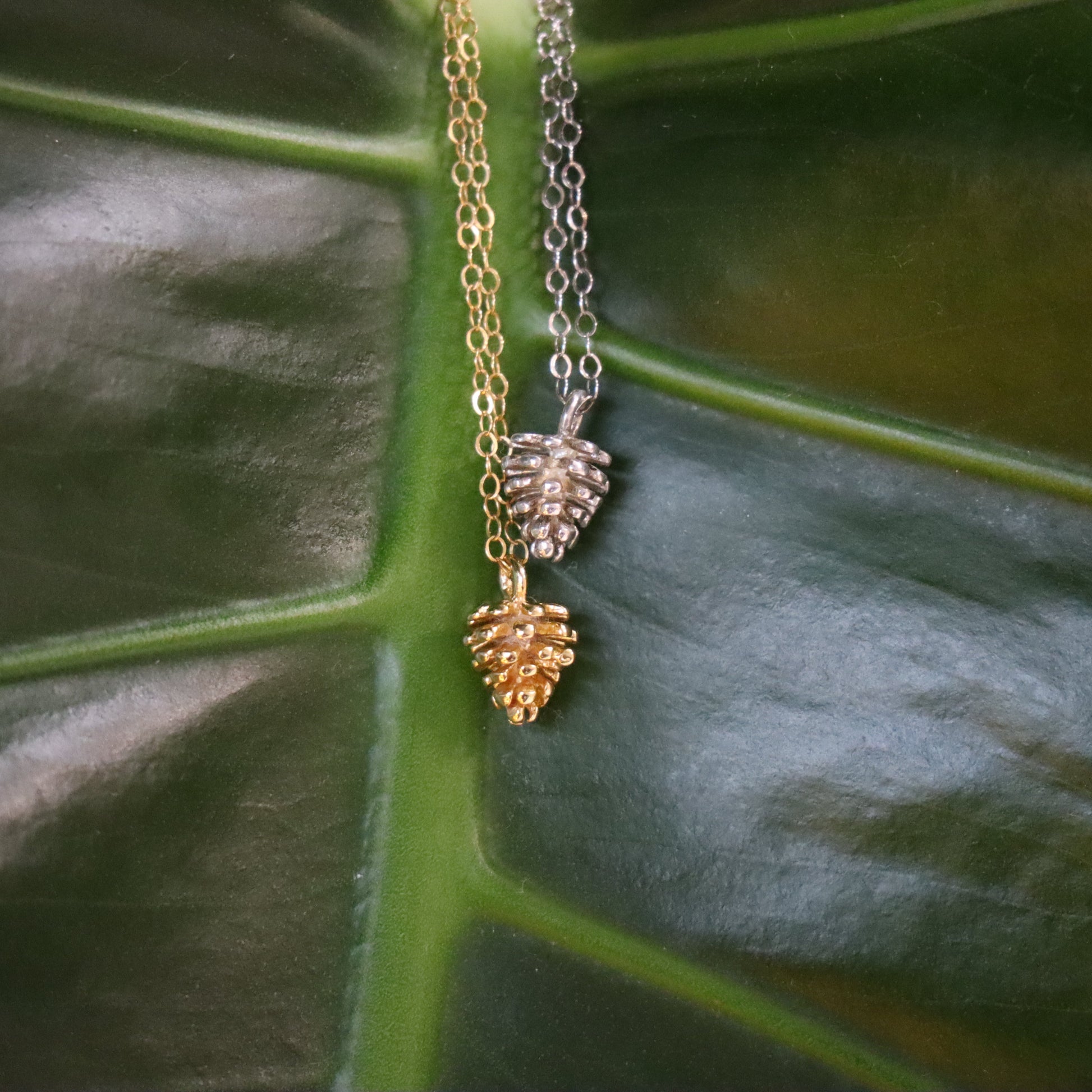 1 Silver &  1 Gold necklace with pinecone pendants