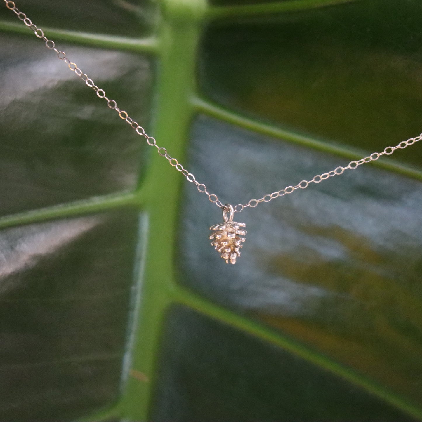 Silver necklace with pinecone charm