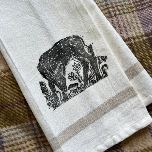 Tea towel with a stamped fawn design in black ink