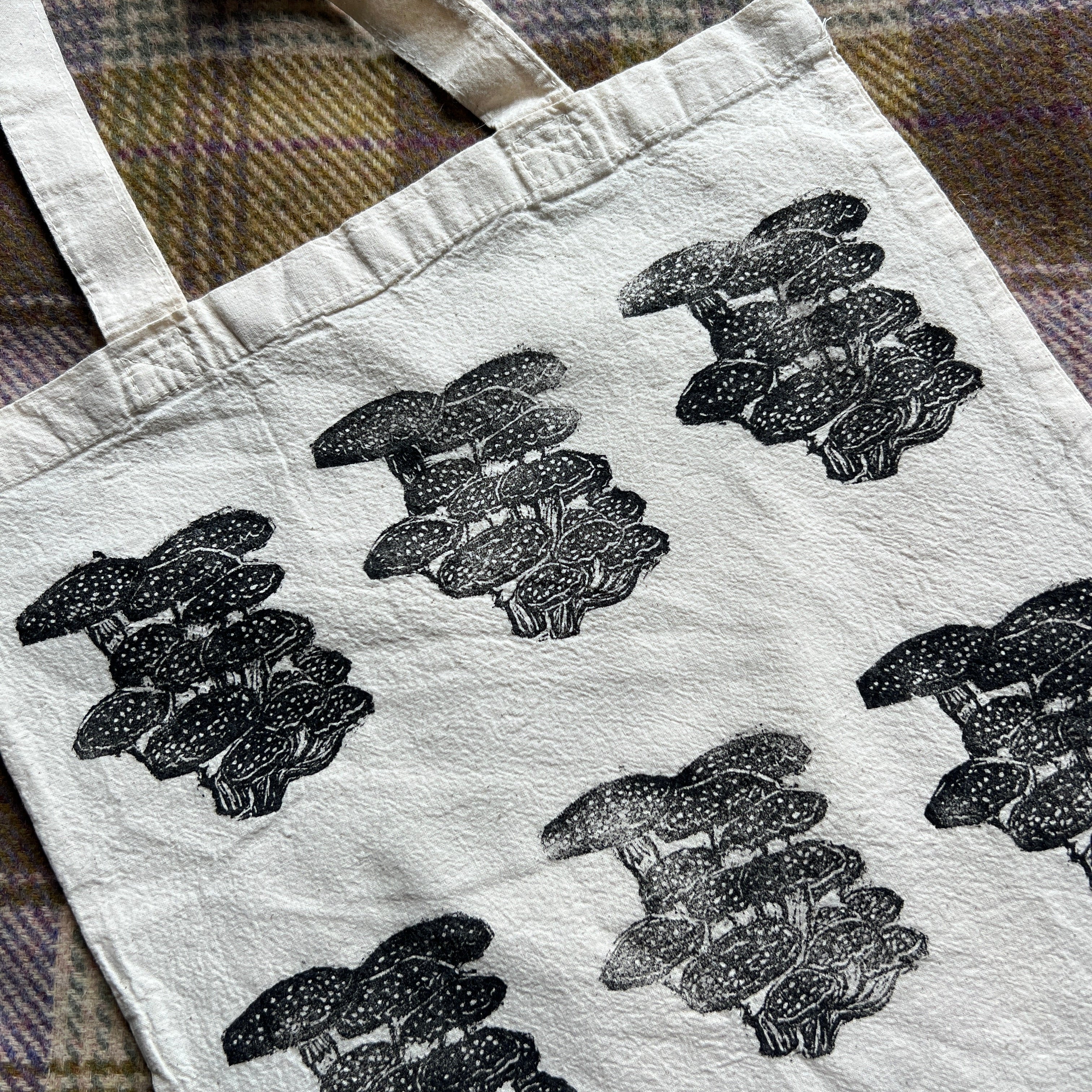 canvas tote bag with black stamped mushroom design