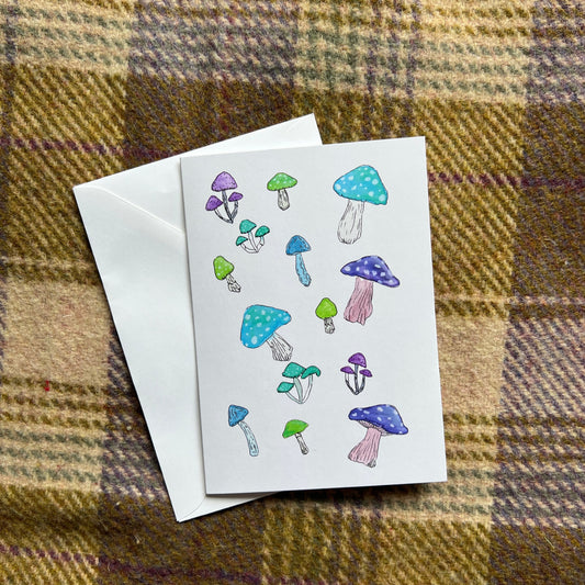 Greeting card with colorful mushrooms